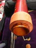 A custom turned wooden sleeve pushes the timber together and into a more round shape